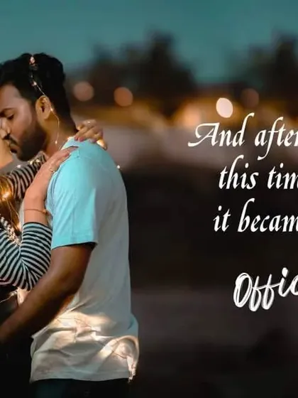 A romantic evening shot of a couple kissing, with fairy lights and text overlay making it feel like a movie scene.