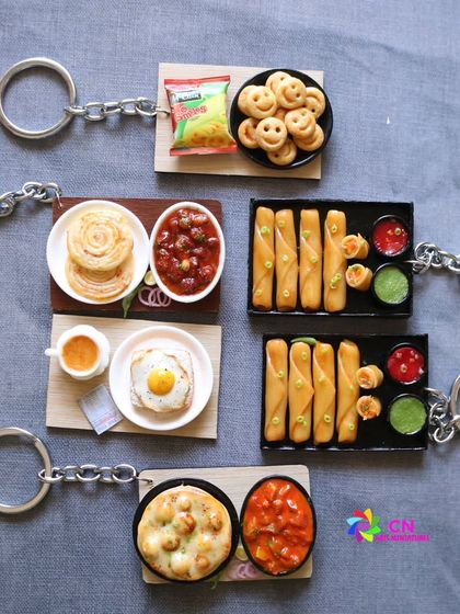 A collection of my food-themed keychains, including parathas, spring rolls, and bread omelette.