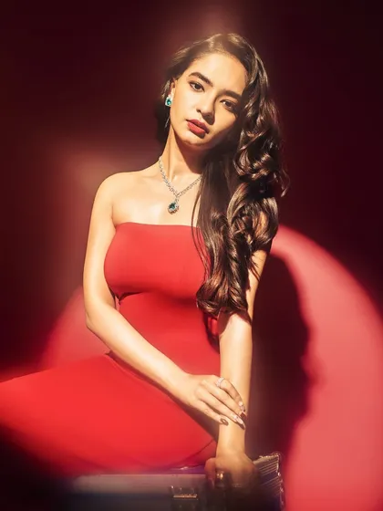 Anushka Sen in a strapless red gown for her Elle feature. The styling here was focused on classic glamour, with elegant jewelry and soft waves to complement the bold color of the dress.