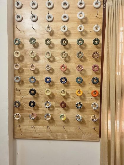 Our glaze test tile wall is a rainbow of possibilities. Each tile shows how a different glaze will look after being fired, helping students choose the perfect finish for their work.