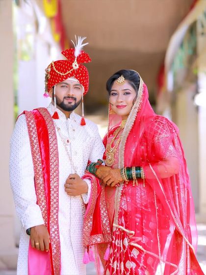 A classic portrait of a Maharashtrian couple. The groom's makeup is designed to look natural and fresh, even in bright daylight.