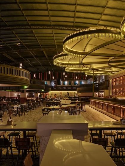 The view across the main floor, highlighting the scale of the venue and the different seating arrangements. The design balances open space with more defined zones to cater to various group sizes and moods.