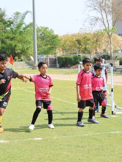A display of sportsmanship as players help each other up. We teach our athletes that respect and fair play are just as important as winning.