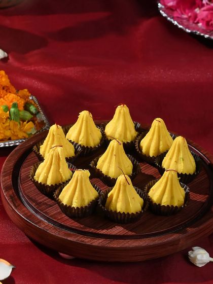 A platter of my golden kesar-flavoured modaks, ready to be offered during your Ganesh Chaturthi puja. The saffron strands add a beautiful aroma and colour.