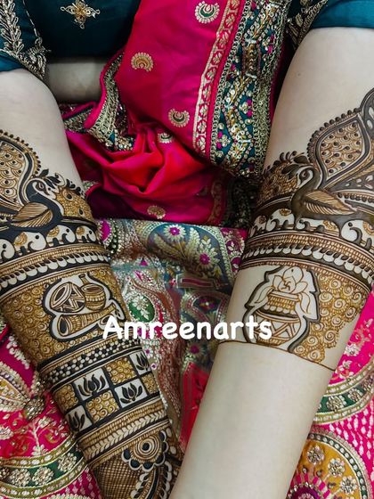 This design beautifully integrates auspicious symbols like the kalash and lotus with elegant peacock motifs.