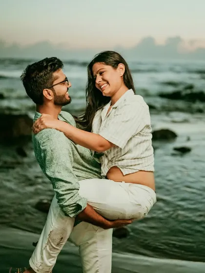 A joyful lift on the beach captures the fun and romance of this couple's Goa pre-wedding shoot. These dynamic and happy moments make for unforgettable memories.