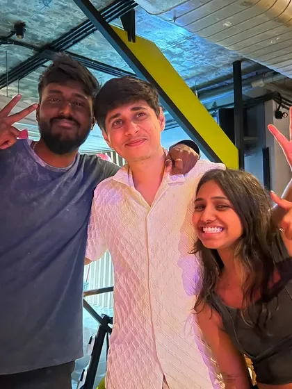 Peace, love, and good vibes. Friends posing for a picture, capturing the fun and colorful spirit of our Holi event.