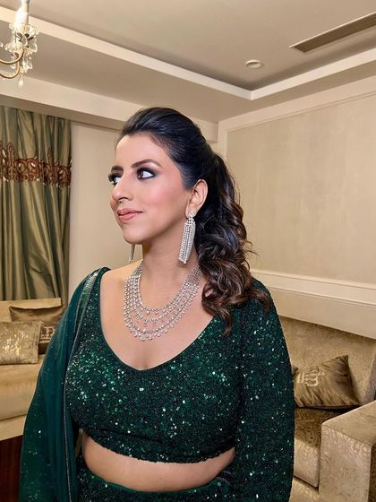 A side profile of the client, her smokey eyes and nude lip creating a balanced, glamorous look.