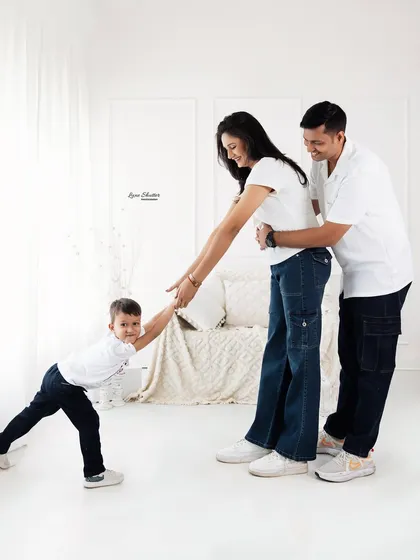 Capturing the playful energy of a toddler during a family session. We let kids be kids, resulting in photos that are authentic and full of life.