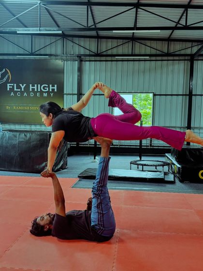 A beautiful and advanced acro yoga pose that combines a backbend with a balanced hold.