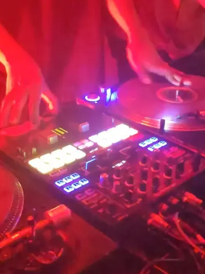 A close up of my hands on the turntables during a live set. This is where the magic happens. I treat turntablism as an art, using scratching and mixing on vinyl to build energy that you can't get from just pressing play.