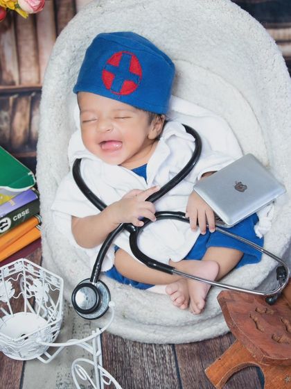 Even doctors have their tough days. This crying newborn in a doctor's outfit is a funny and relatable moment for any parent.