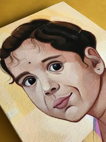 A detail shot of the acrylic portrait of Varnika. The canvas texture adds a beautiful, classic feel to the finished painting, enhancing the soft, painterly style.