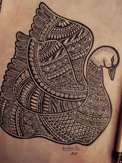 The finished zentangle swan drawing, shown with the pen used to create the thousands of tiny lines.