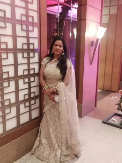 Another shot of the graceful beige and gold lehenga, a timeless choice for any occasion.
