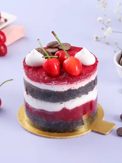 A mini version of our popular Black Forest cake. This individual dessert has layers of chocolate sponge, fresh cream, and a tangy cherry compote, topped with fresh cherries.