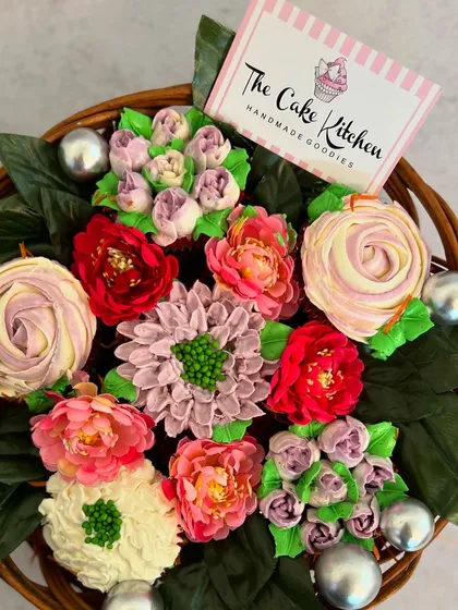I also create these beautiful cupcake bouquets. Each cupcake is topped with intricately piped buttercream flowers, arranged together in a basket to look like a real floral arrangement you can eat.