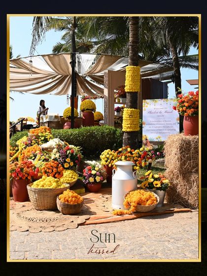 A 'Phoolon Ki Mandi' themed Haldi at ITC Goa. This setup is a visual delight, with an explosion of citrus-hued marigolds and other blossoms creating a traditional yet refreshing look.