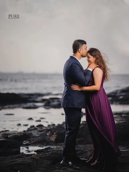 A sweet forehead kiss on a windy beach. The movement in Kiran's hair and the soft light give this photo a candid and natural feel.