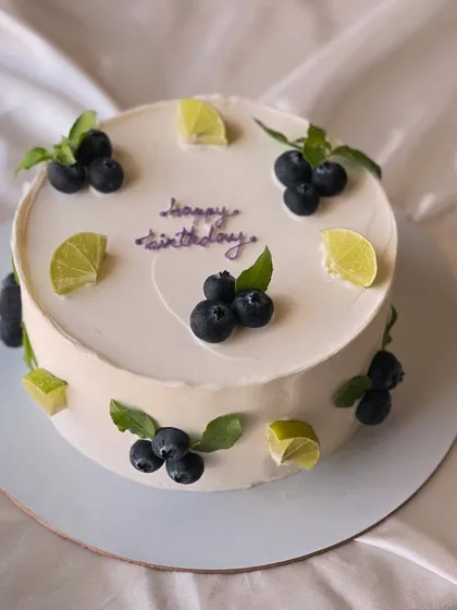 My most popular creation, the signature Italian Lemon & Blueberry cake. I offer many design variations, all featuring fresh blueberries, zesty lime, and smooth buttercream.