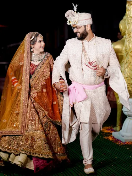 A candid and happy shot of the couple walking together during their wedding ceremony.