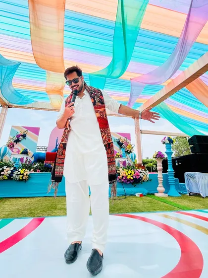 Another angle from the vibrant Mehndi event. The colorful drapes and my energy are a perfect match for a fun-filled day.