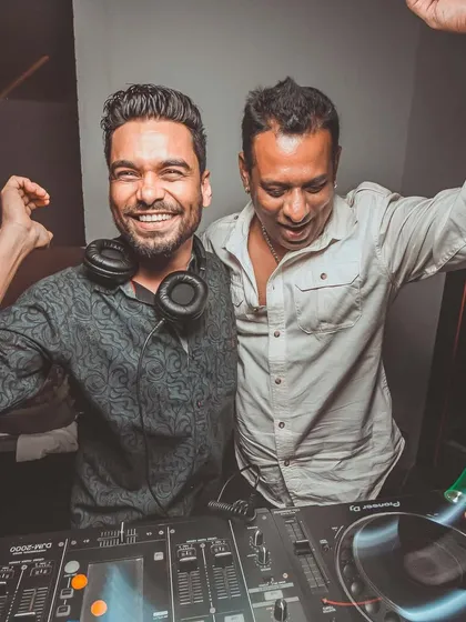 The energy is always high behind the booth. Here I am celebrating a great set with a friend and fellow music lover.