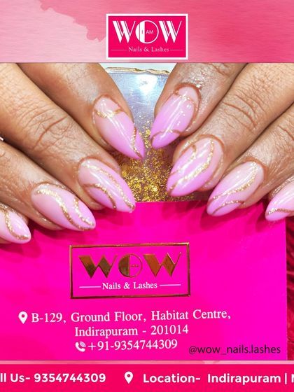 A gorgeous combination of soft pink and sparkling gold on almond-shaped extensions. The delicate gold swirls add a touch of elegance and sophistication to this feminine design.