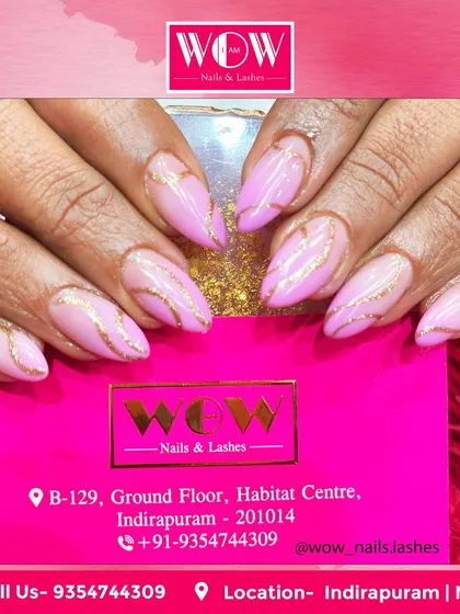 A gorgeous combination of soft pink and sparkling gold on almond-shaped extensions. The delicate gold swirls add a touch of elegance and sophistication to this feminine design.