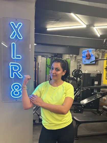 A happy and strong member showing off her progress. This is the confidence that comes from feeling fit and powerful.