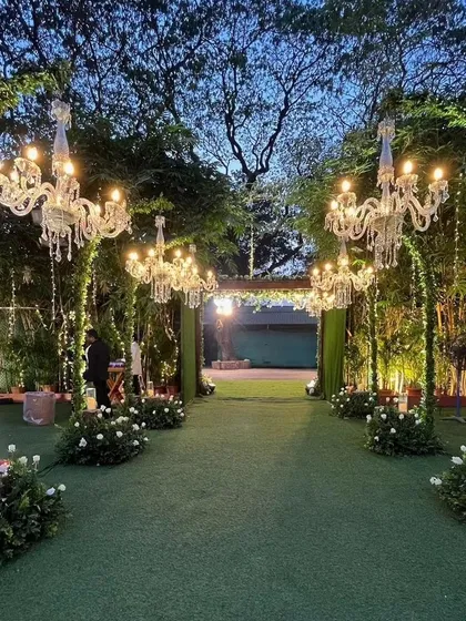 We create magical beginnings with enchanting entrance walkways. Here, lush greenery and elegant crystal chandeliers guide you and your guests into a world of celebration, setting a tone of sophisticated romance for the evening ahead.