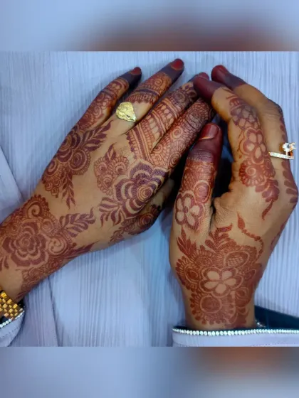 Both hands are shown here, displaying the beautiful, consistent stain of the floral party henna. My organic paste ensures a great color payoff every time.