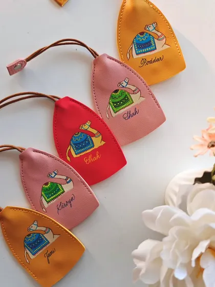 A colorful collection of my hand painted and personalized camel keychains. The different colors and names show how a single concept can be customized to create unique gifts for many different people.