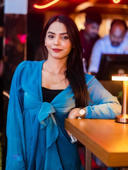 A guest looking elegant by the bar.