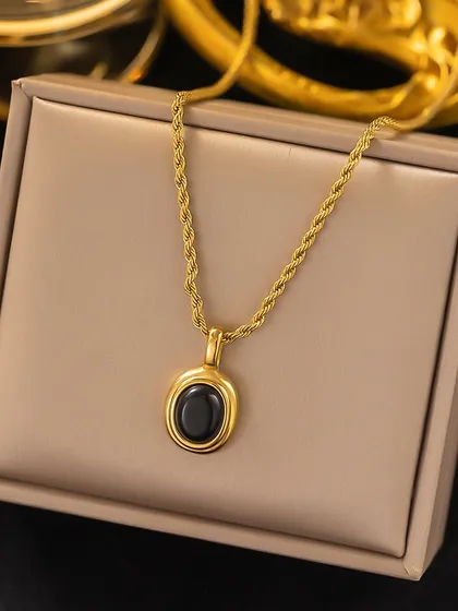 I love the classic combination of black and gold. This necklace features a polished black oval stone set in a gold-tone pendant on a sturdy rope chain, all made from original stainless steel.