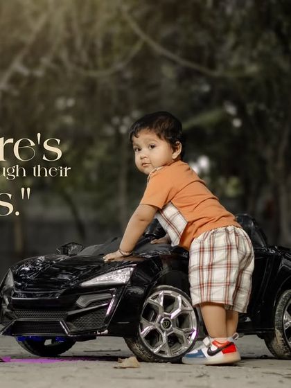 Nature's wonders through their eyes. A little boy stands with his toy car on a path surrounded by trees.