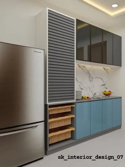 This kitchen design features a tall pantry unit with a rolling shutter and wicker baskets. The dual-tone blue and grey cabinets add a modern touch.
