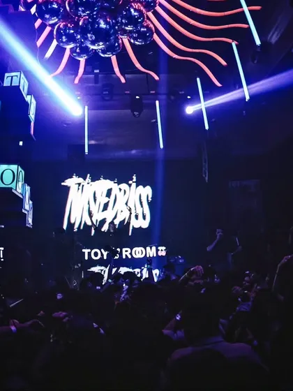 My branding lit up on the big screen at Toy Room, Pune. It is always a great feeling to see my name above a packed, energetic dance floor.