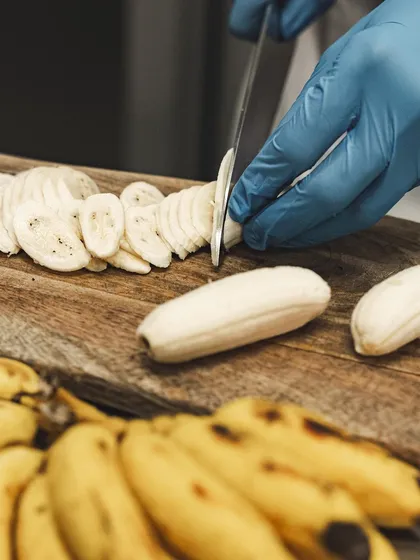 Slicing fresh Yelakki bananas, a key ingredient for our popular Banoffee Pie.