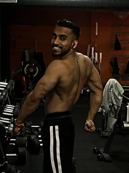 A strong back is essential for overall fitness and a balanced physique. This pose showcases the muscle definition achieved through consistent training.
