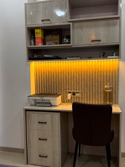 A close-up of the backlit study table in the second bedroom.