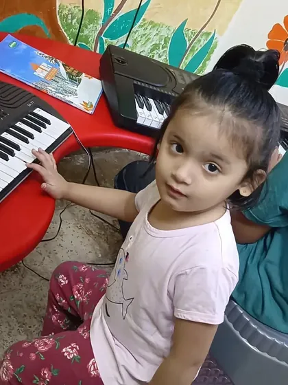 A quiet moment of focus from one of our youngest students at the piano. We believe in starting the musical journey early.