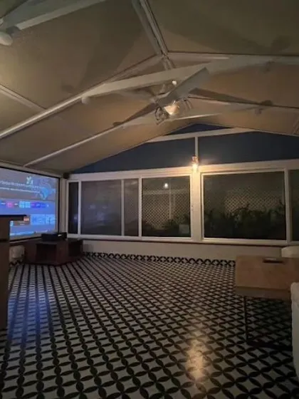 Our sunrooms can be anything you want them to be. Here, a glass sunroom with retractable blinds and bold Moroccan tiled flooring transforms into a private home theatre at night for Mr. Amar Nagaram.