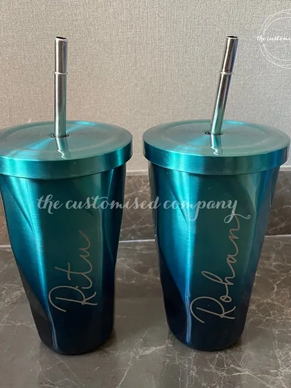 This personalized chrome tumbler with a matching steel straw has a stunning iridescent finish. It's a stylish and modern drinkware option that can be customized with a name.