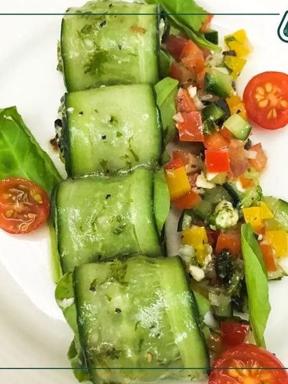 A creative and refreshing cucumber roll-up salad. We use thinly sliced cucumber to wrap a filling of fresh veggies and paneer, making it a light, crunchy, and hydrating snack or appetizer.