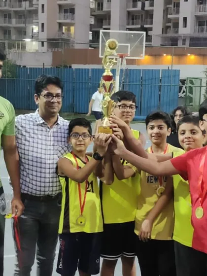 A moment of celebration with one of our winning boys' teams. Their hard work and team spirit earned them this trophy.