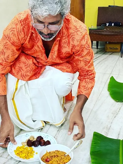 Here I am, preparing for an Onam Sadya at home. I believe in the personal touch, so I prepare and serve every dish myself, ensuring the meal is authentic and made with care.