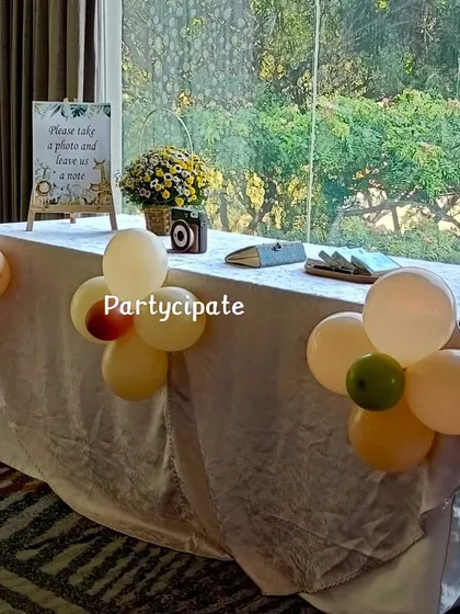 A guest book table is a lovely touch for a first birthday. I set up this simple and elegant table for guests to leave photos and notes for the family.