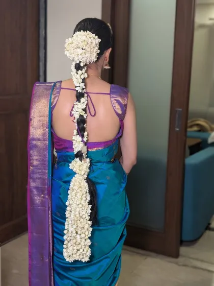Hair artistry is a key part of the complete bridal look. This stunning cascaded mogra braid we created for our Tamil bride is a perfect example of how traditional elements can be styled in a modern and elegant way.