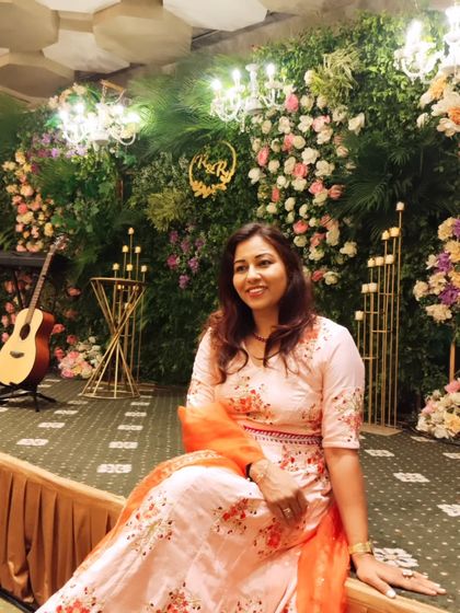 A quiet moment amidst the beautiful floral decor. The guitar adds a touch of musical charm to the setting.